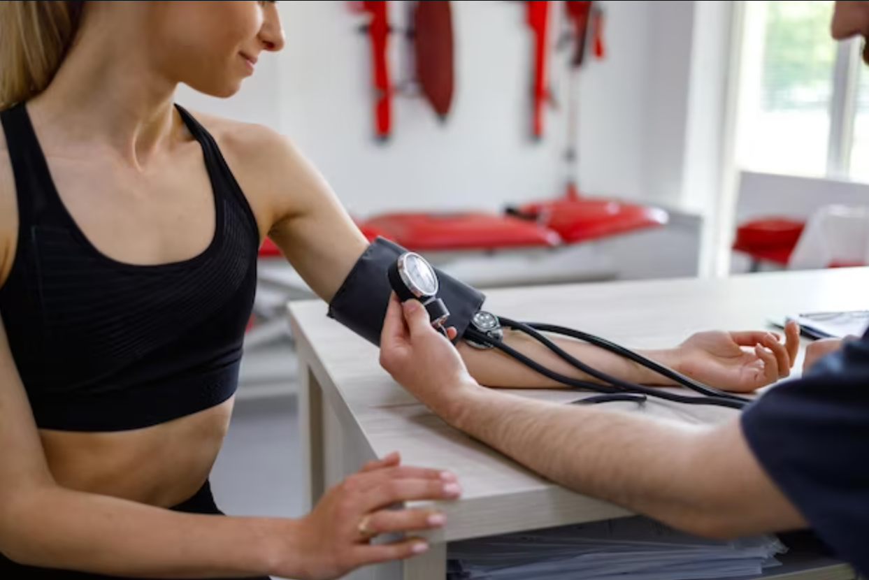 An athlete having blood pressure checked